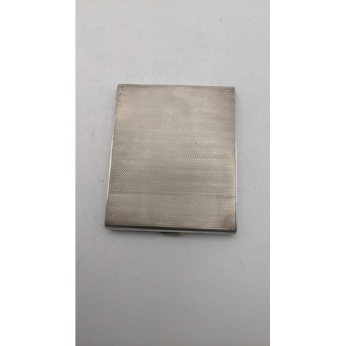 47 - A RN silver cigarette case hallmarked Birmingham 1925 having engine turned wavy design, total weight... 