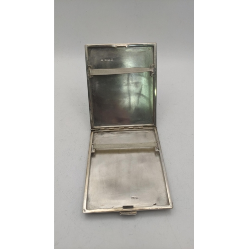 47 - A RN silver cigarette case hallmarked Birmingham 1925 having engine turned wavy design, total weight... 