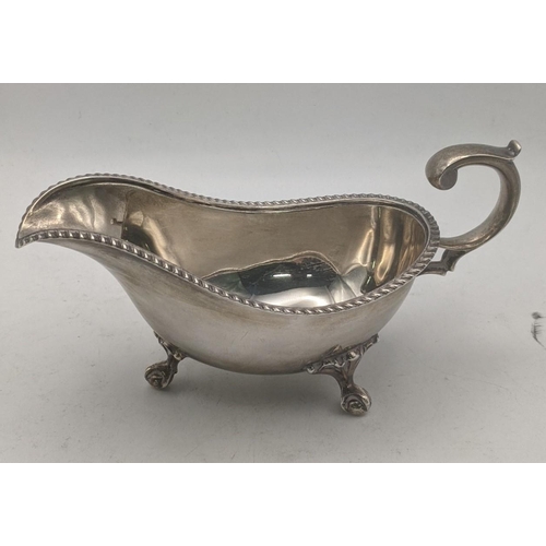 48 - A Joseph Rodgers and sons silver sauce boat on three claw feet hallmarked Sheffield 1904, 177.1g
Loc... 