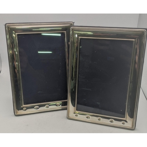 53 - A pair of Carrs of Sheffield silver photo frames 18.5cm x 13.5cm exterior, 14.5cm x 9.5cm interior h... 