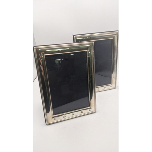 53 - A pair of Carrs of Sheffield silver photo frames 18.5cm x 13.5cm exterior, 14.5cm x 9.5cm interior h... 