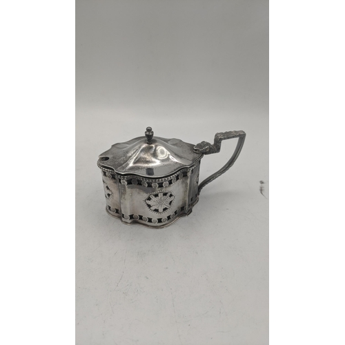 54 - Silver to include a group of pierced mustard pots and a salt's all with blue glass liners, total wei... 