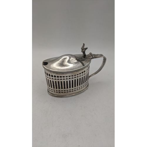 54 - Silver to include a group of pierced mustard pots and a salt's all with blue glass liners, total wei... 