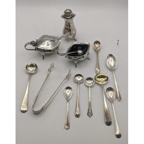 56 - Silver to include a set of condiments together with a variety of condiment spoons, a teaspoon, and a... 