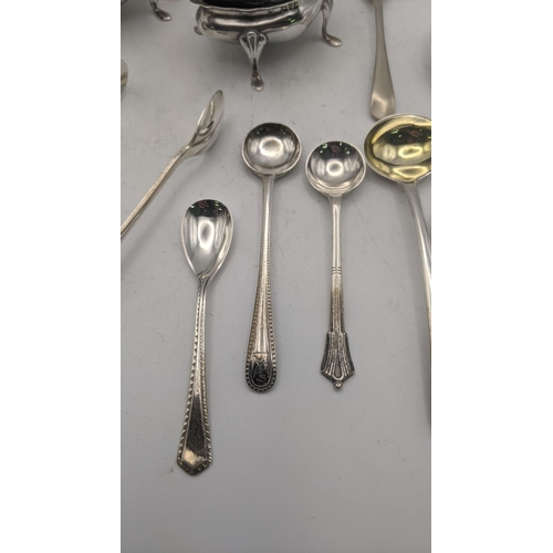 56 - Silver to include a set of condiments together with a variety of condiment spoons, a teaspoon, and a... 