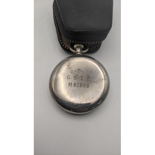 60 - A WWI military pocket watch engraved to the back G.S.T.P M82896 A/F with a brown pocket watch strap
... 