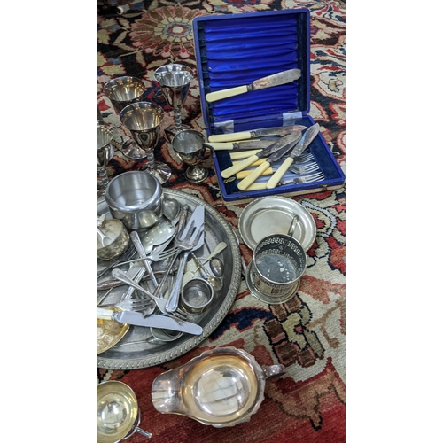 432 - A mixed lot of mainly silver plate to include boxed cutlery, berry spoon, trophies and other items
L... 