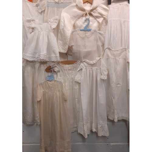 110 - A quantity of vintage baby and young children's white and cream clothing to include a christening dr... 