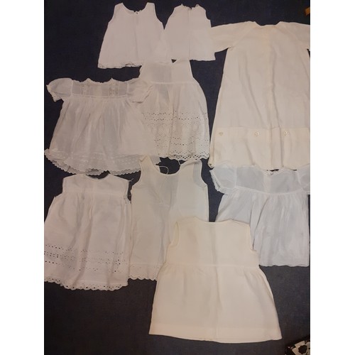 110 - A quantity of vintage baby and young children's white and cream clothing to include a christening dr... 