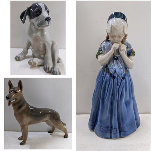 558 - Three Royal Copenhagen porcelain ornaments to include a pointer puppy, number 051, 20.5h, an Alsatia... 