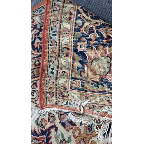 337 - A Persian hand woven rug having a central motif, floral design and multiguard borders, 255cm x 176cm... 