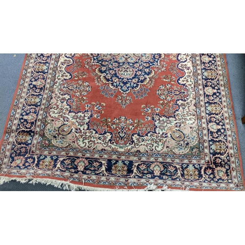 337 - A Persian hand woven rug having a central motif, floral design and multiguard borders, 255cm x 176cm... 