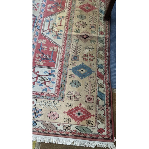 338 - A Turkish Milas Toban hand woven carpet having geometric designs, three central lozenge motifs and t... 