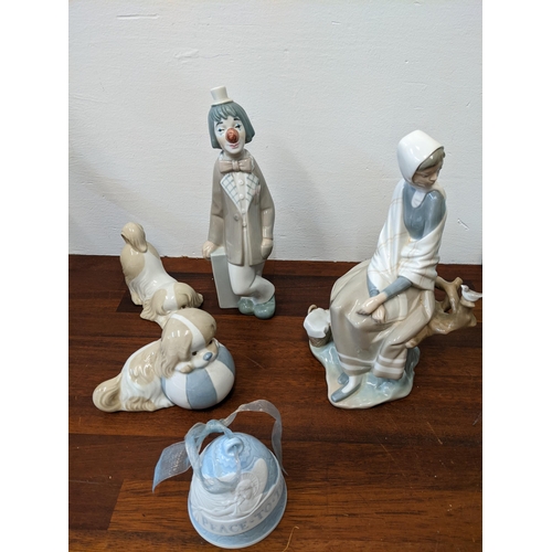 400 - Lladro figures to include 'New Shepherdess', 'Casades Clown', a 'Peace to the World 2003' bell and t... 