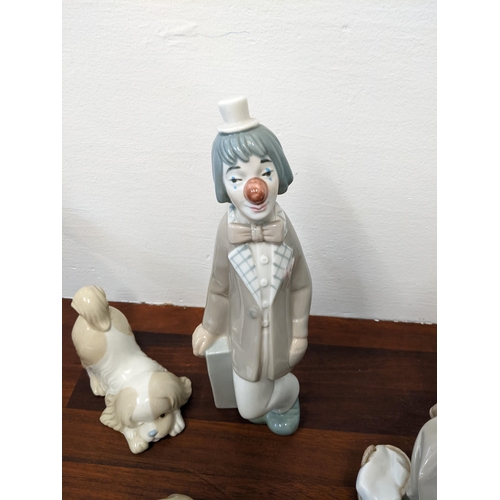 400 - Lladro figures to include 'New Shepherdess', 'Casades Clown', a 'Peace to the World 2003' bell and t... 