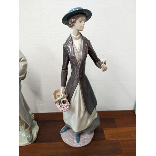 403 - Two Lladro figurines to include 'Old Man with Violin' and 'Tokens of Love' both in original boxes
Lo... 