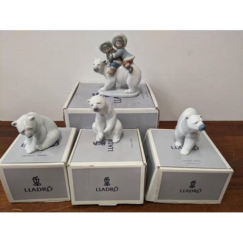 404 - Lladro figures to include three polar bears and 'Eskimo Riders' all in their original boxes and pack... 