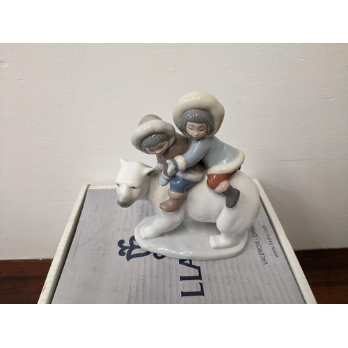 404 - Lladro figures to include three polar bears and 'Eskimo Riders' all in their original boxes and pack... 