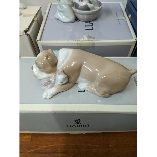 405 - Dog related Lladro porcelain figures to include 'Unlikely Friends', Nao by Lladro 'Dog Lying Down', ... 