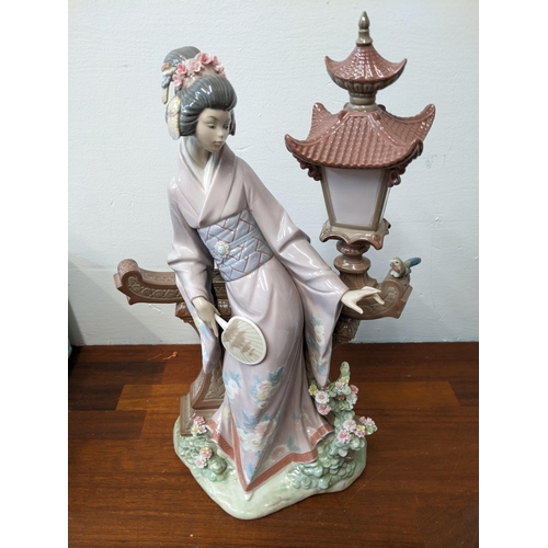 409 - Lladro 'Geisha in Garden' porcelain figurine, unboxed with a boxed Lladro 'Geisha Girl' figure
Locat... 