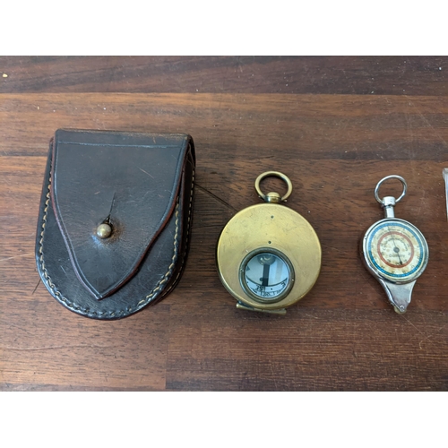 446 - A Barker & Son marching military compass No50 in a leather case, a brass cased compass in leather ca... 