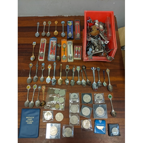 450 - A mixed lot to include commemorative coins and a large collection of souvenir spoons Location: A3F
I... 