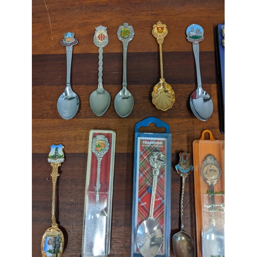 450 - A mixed lot to include commemorative coins and a large collection of souvenir spoons Location: A3F
I... 