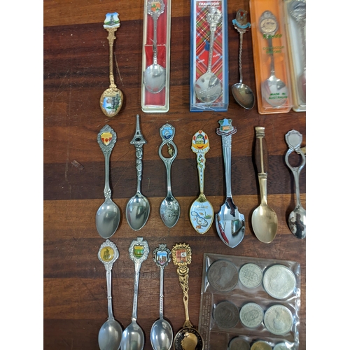 450 - A mixed lot to include commemorative coins and a large collection of souvenir spoons Location: A3F
I... 