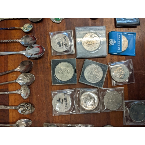 450 - A mixed lot to include commemorative coins and a large collection of souvenir spoons Location: A3F
I... 