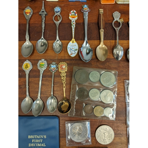 450 - A mixed lot to include commemorative coins and a large collection of souvenir spoons Location: A3F
I... 