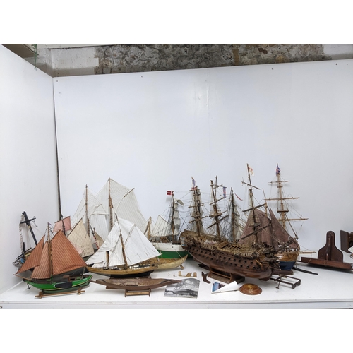 463 - A fleet of wooden model sailing vessels to include a large three-masted model of HMS Victory, and a ... 