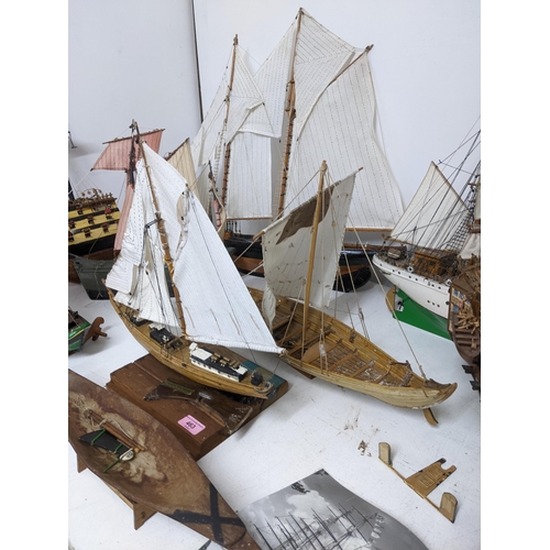 463 - A fleet of wooden model sailing vessels to include a large three-masted model of HMS Victory, and a ... 