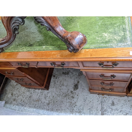 473 - A reproduction mahogany twin pedestal desk and matching two-drawer filing cabinet, each with inset g... 