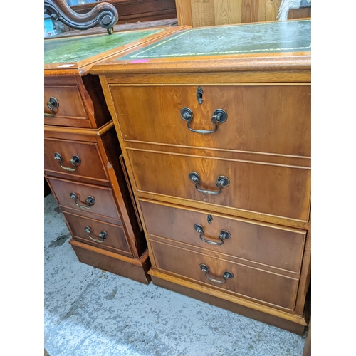 473 - A reproduction mahogany twin pedestal desk and matching two-drawer filing cabinet, each with inset g... 