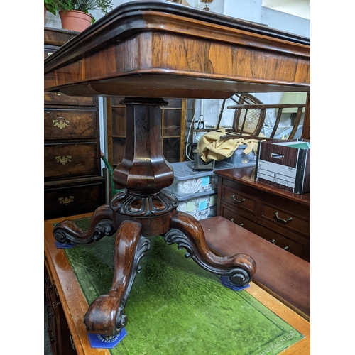 478 - A William IV rosewood swivel top folding card table, fluted octagonal baluster column support above ... 