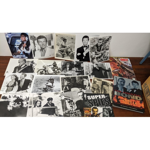 484 - James Bond 007, a collection of James Bond related items to include Books, magazines, Roger Moore fi... 