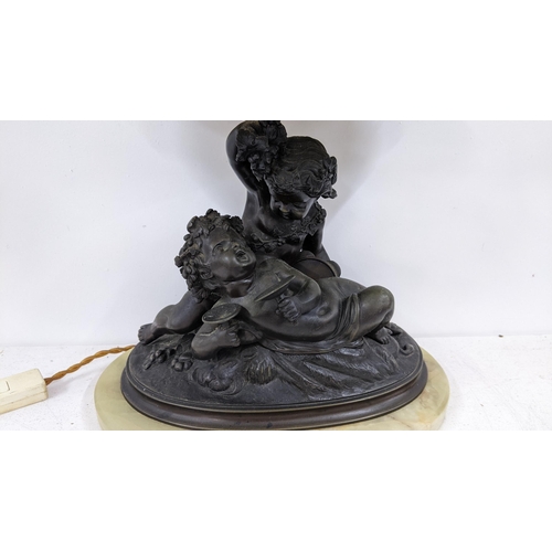 501 - A 19th century spelter figural group table lamp of two putti mounted on marble base, 40.5cm h includ... 