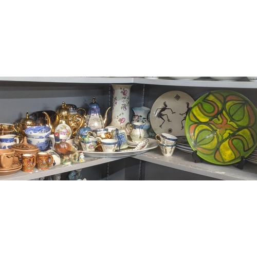 513 - A mixed lot of ceramic and pottery examples to include a Poole pottery dish, coffee pot,cans and sau... 