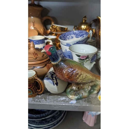 513 - A mixed lot of ceramic and pottery examples to include a Poole pottery dish, coffee pot,cans and sau... 