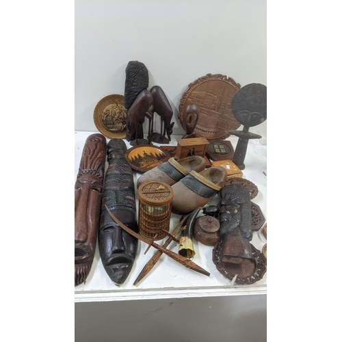 515 - Mixed treen items and collectables to include a set of coasters, wall hanging tribal masks and other... 