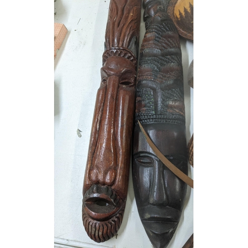 515 - Mixed treen items and collectables to include a set of coasters, wall hanging tribal masks and other... 