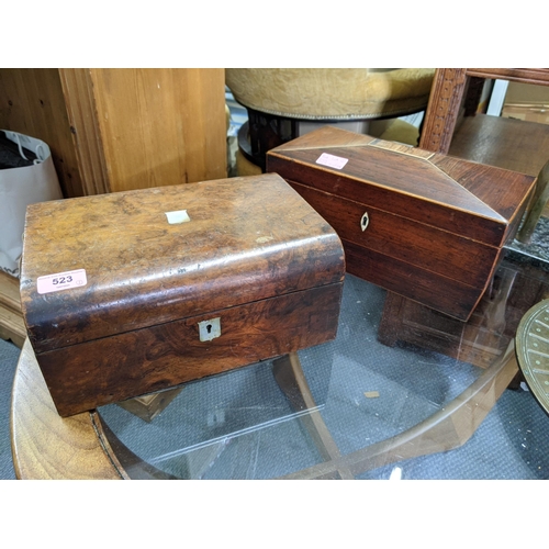 523 - A late 19th/early 20th century rosewood tea caddy of sarcophagus form with the presentation glass an... 