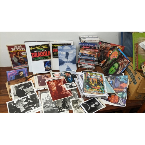 533 - Film and music memorabilia to include 12 VHS tapes, boxed, DVD's, signed VHS cover by Graham Humphre... 