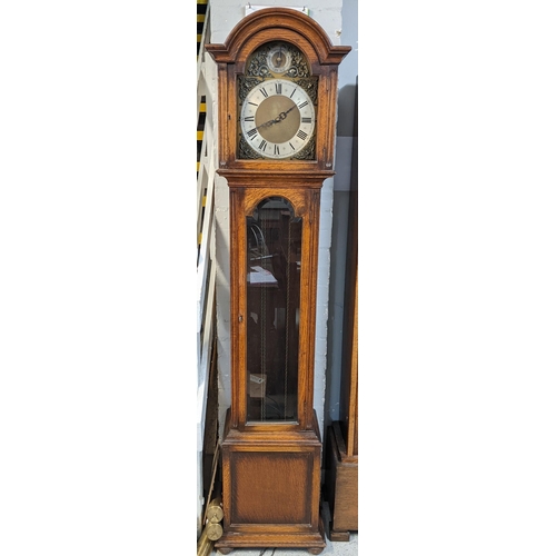 553 - An early/mid 20th century oak longcase clock having a selection dial for Westminster, St Michael and... 