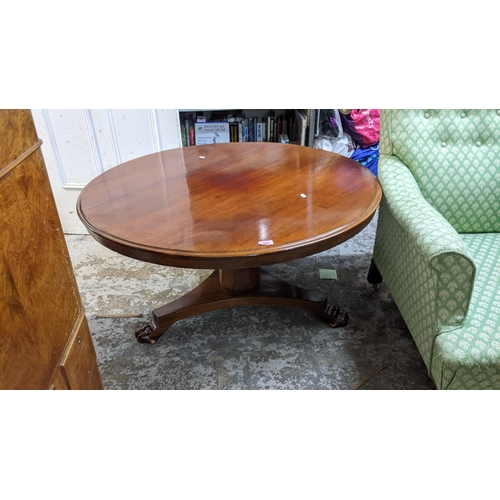 560 - An altered 19th century mahogany table with paw feet, 52cm h x 105cm dia
Location:STAIRS
If there is... 