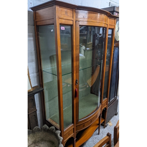 590 - Edwardian inlaid mahogany bow fronted display cabinet, floral decoration in the Art Nouveau style, g... 