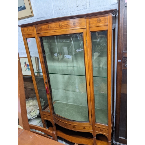 590 - Edwardian inlaid mahogany bow fronted display cabinet, floral decoration in the Art Nouveau style, g... 