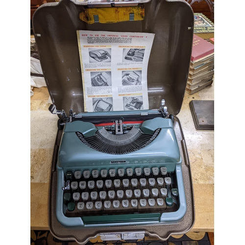 595 - A vintage L C Smith and Bros typewriter, and a metal cased mid-century Imperial Good Companion typew... 