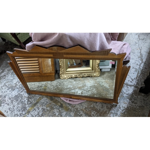 598 - An Art Deco walnut veneered, marquetry mirror, 66cm h x 125cm w
Location:G
If there is no condition ... 