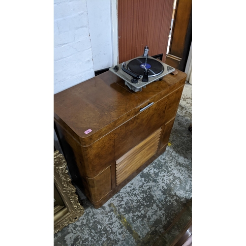 599 - An Art Deco walnut music cabinet with a hinged lid, 94cm h x 97cm w and a Collaro record player, mod... 